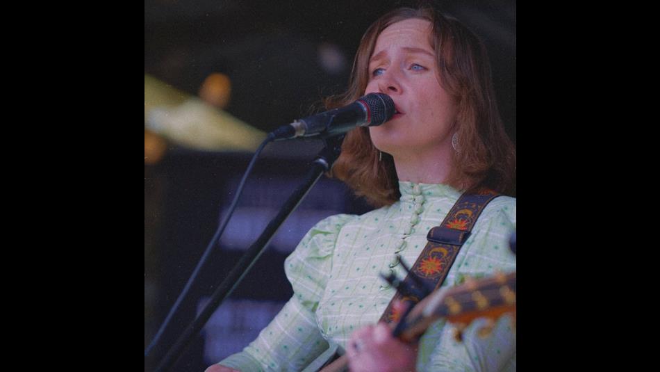Emma Robson performing on stage.