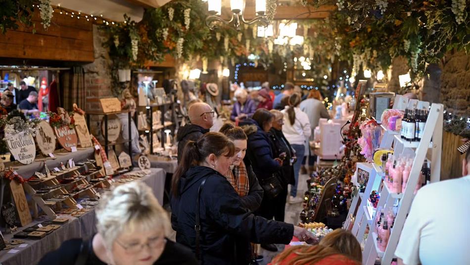 Visitors enjoying browsing stalls at South Causey Inn's Christmas market.
