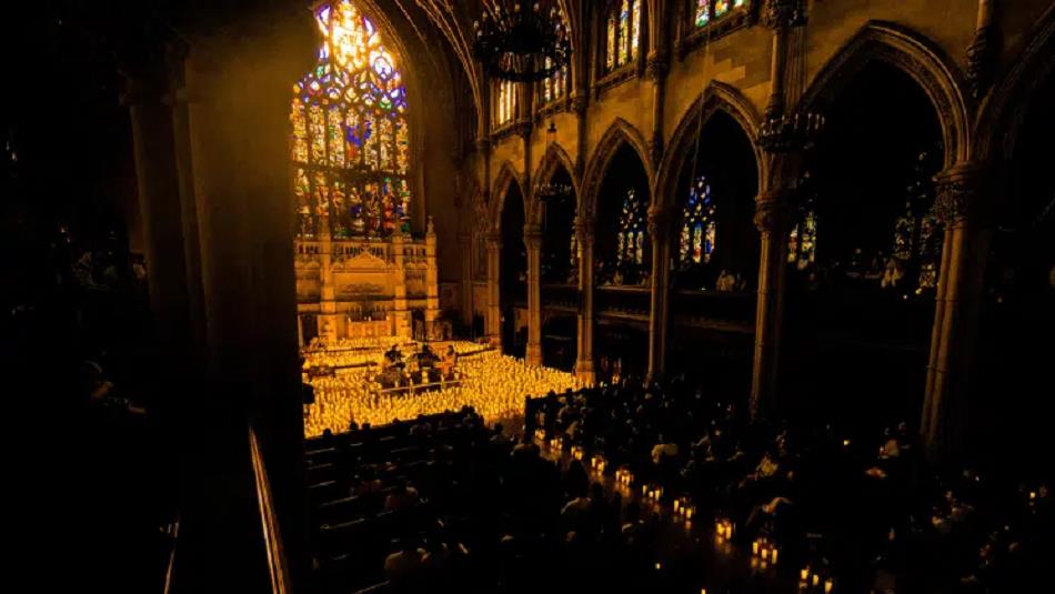 Musicians surrounded by candles in the chapel.