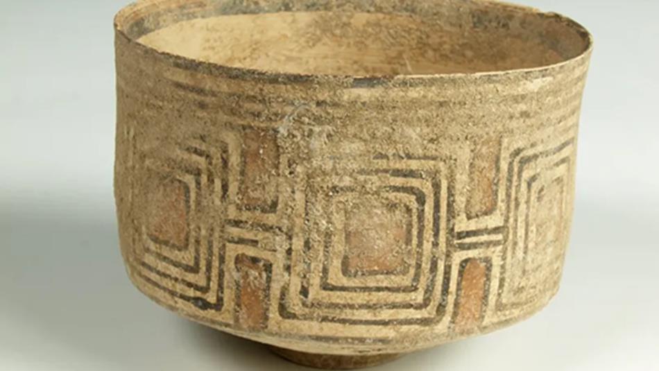 A small ceramic bowl decorated with geometric patterns.