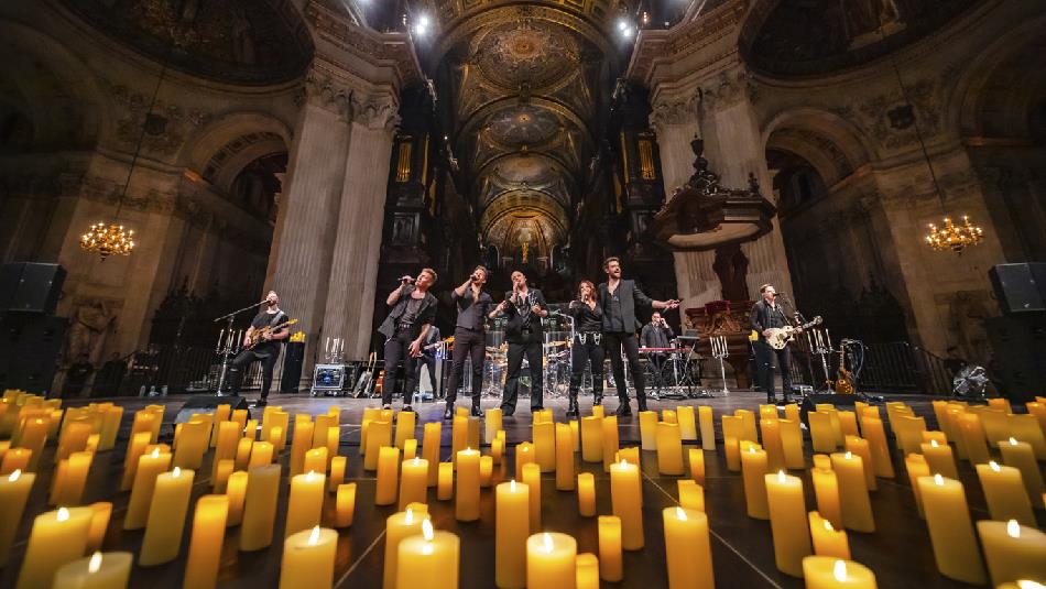 U2 tribute band surrounded by candles.