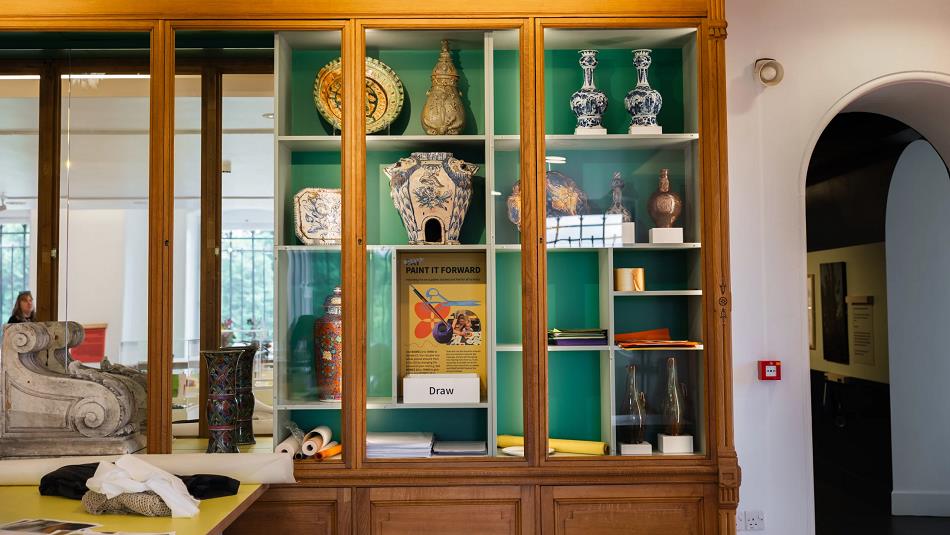 Cabinet showing a variety of ceramics.