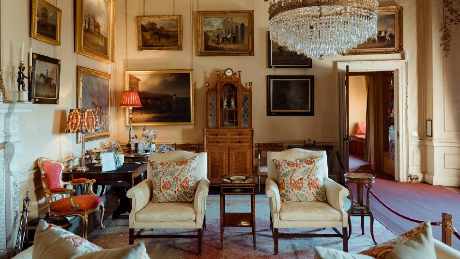 Opulent room at Raby Castle with a chandelier and paintings