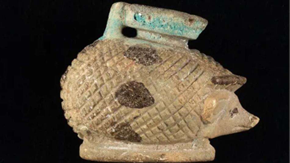 A small, pottery figure in the shape of a hedgehog, made by the Phoenicians.