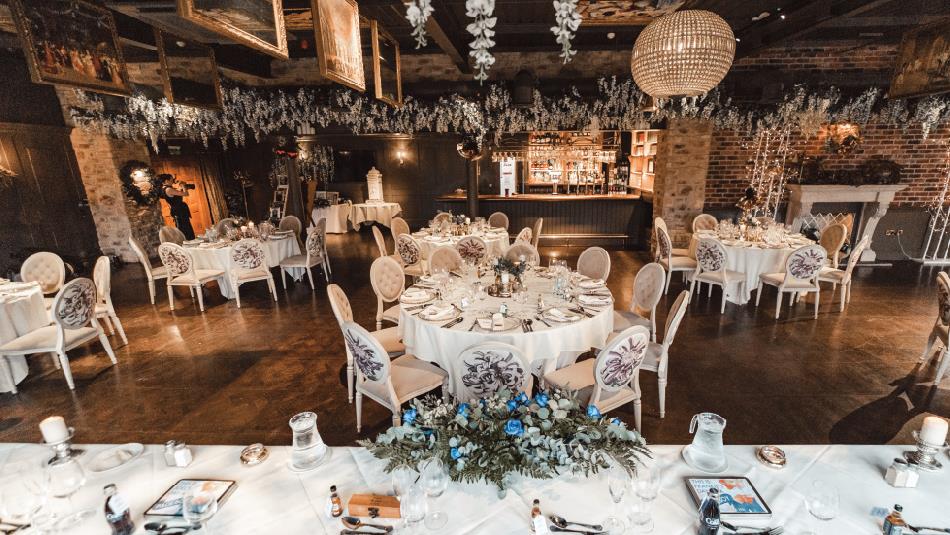 Bowburn Hall Hotel - tables staged for a wedding, with beautiful floral centre pieces.