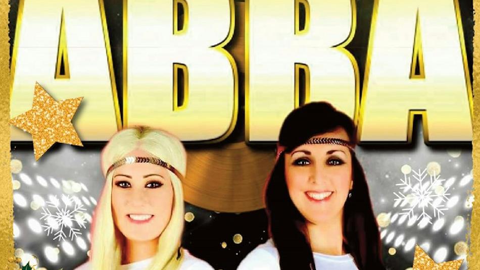 Abba Tribute 'Voulez 2' members smiling. Poster decorated with snowflakes and gold stars.