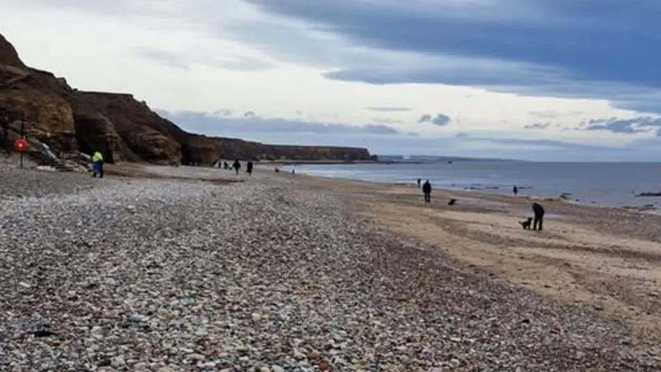 People on Seaham Hall Beach.