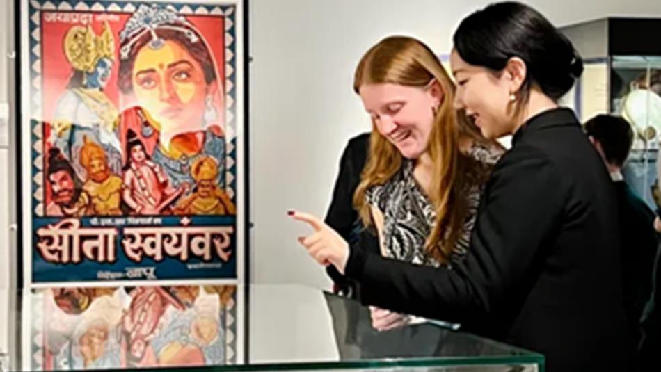 Two women looking at a display cabinet in the Oriental Museum.