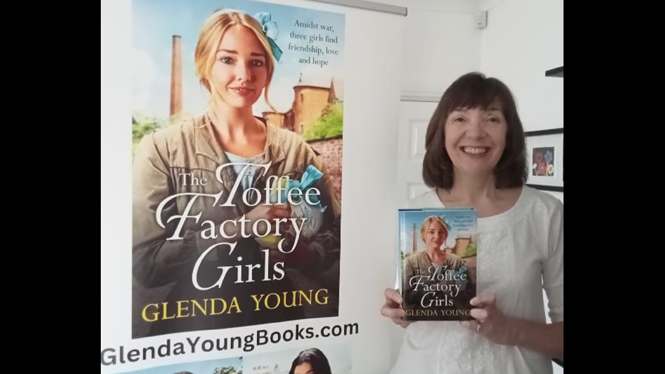 Author Glenda Young holding a copy of her book, 'The Toffee Factory Girls'.