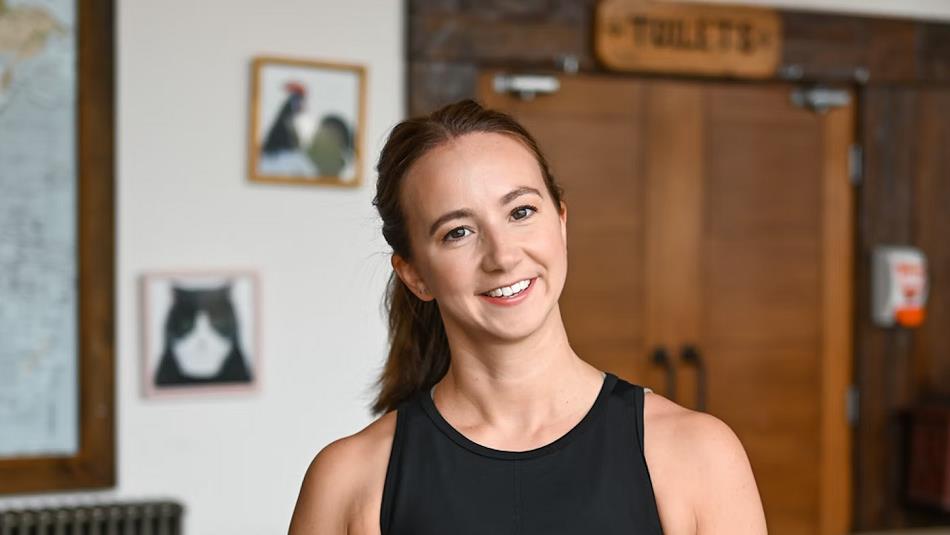 Yoga instructor smiling.