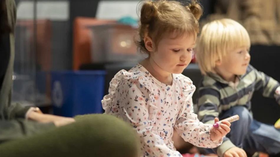 Little girl and boy participating in 'Little Dragons' at Durham University Oriental Museum.