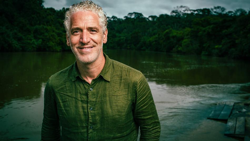 Gordon Buchanan standing in front of a lake.
