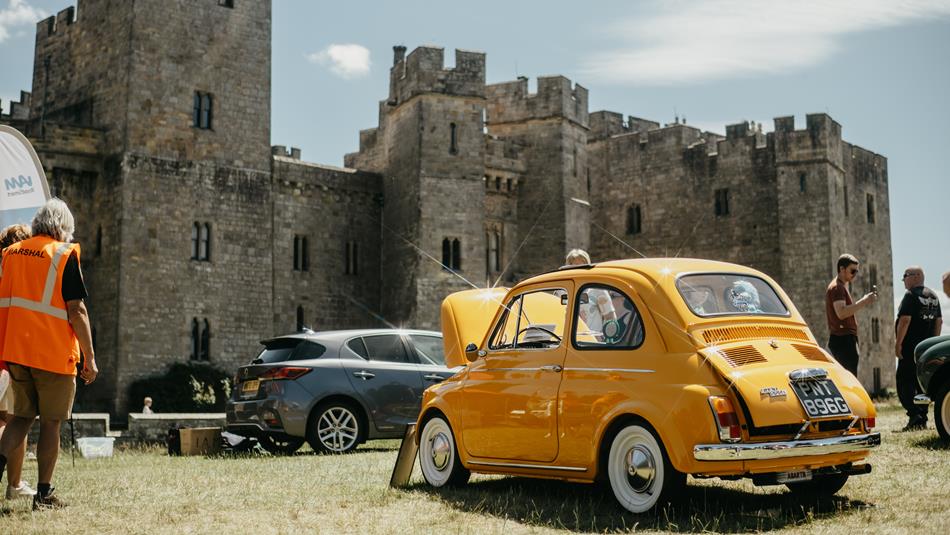 Yellow classic car at Raby Castle.