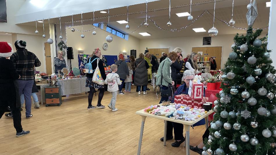 People browsing stalls at Sacriston Christmas Market at The Fulforth Centre