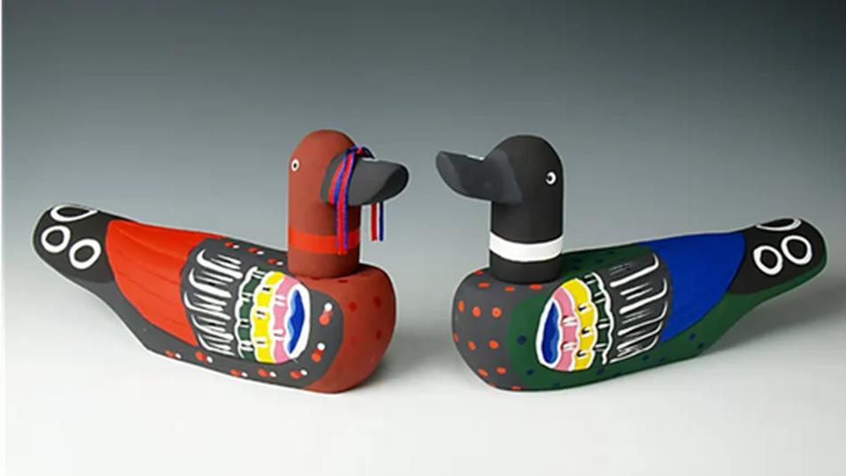 A pair of colourful wooden Korean wedding ducks.