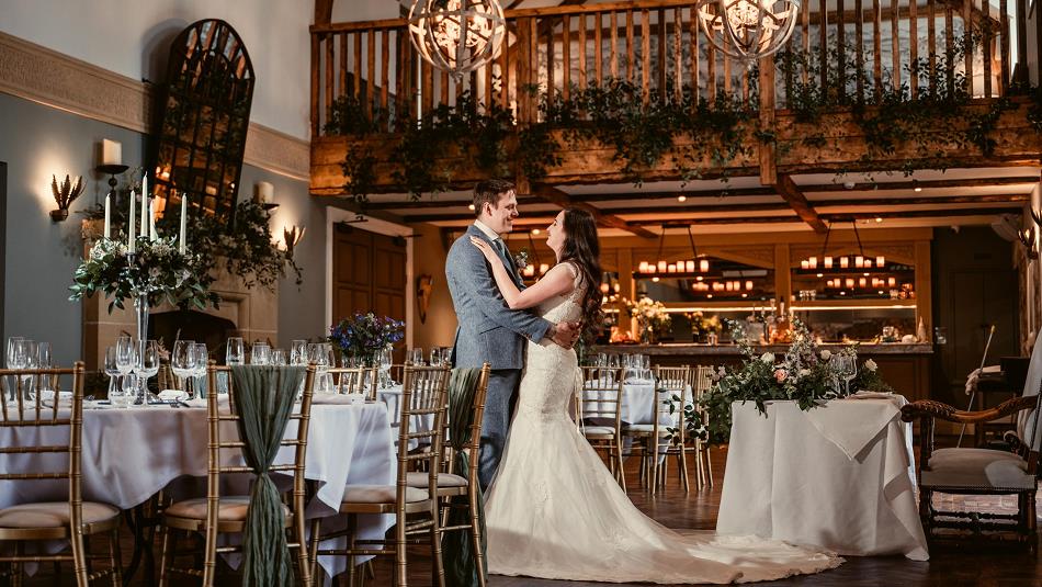 Bride and Groom embracing at The Manor House Hotel and Spa.