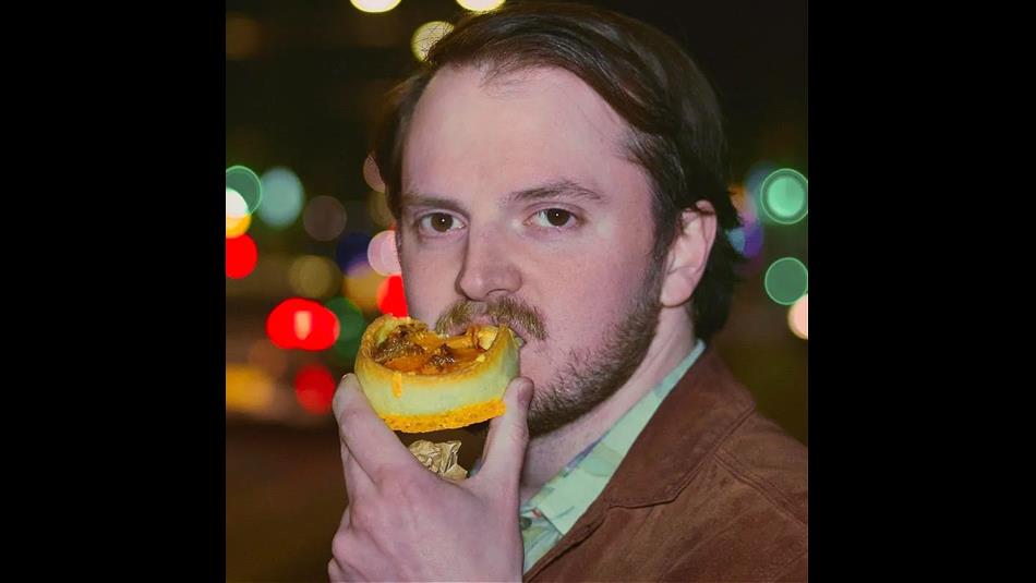 Headshot of Cobin Millage eating a snack