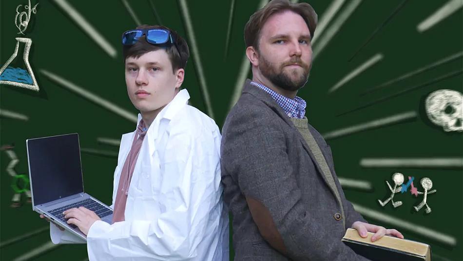 Comedy duo Mitch and Alastair standing back to back in science clothes.