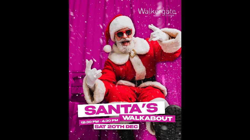 Santa Claus wearing red festive suit and sunglasses.