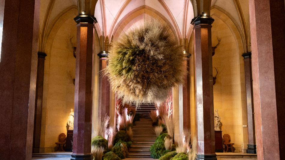 Floral decorations surround an opulent staircase in Raby Castle.
