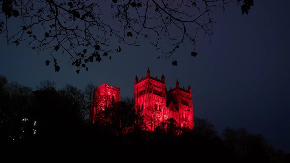 Durham Cathedral at night lit up in red