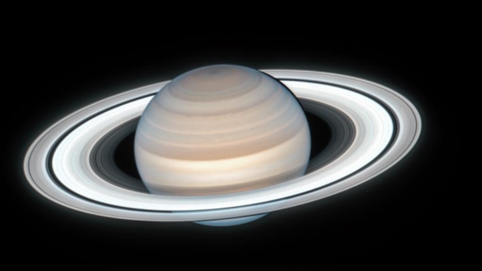 The planet Saturn in the dark night sky