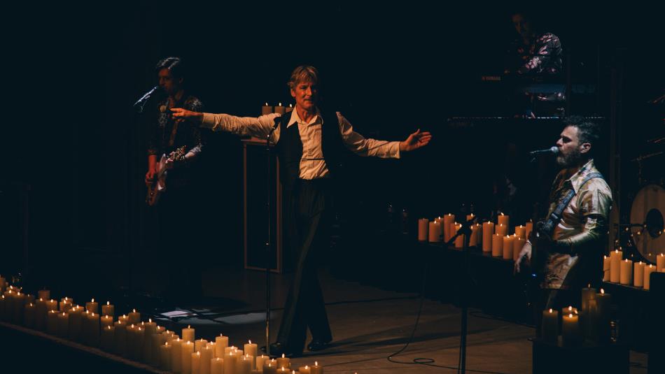 Bowie Tribute artists performing on a candlelit stage.