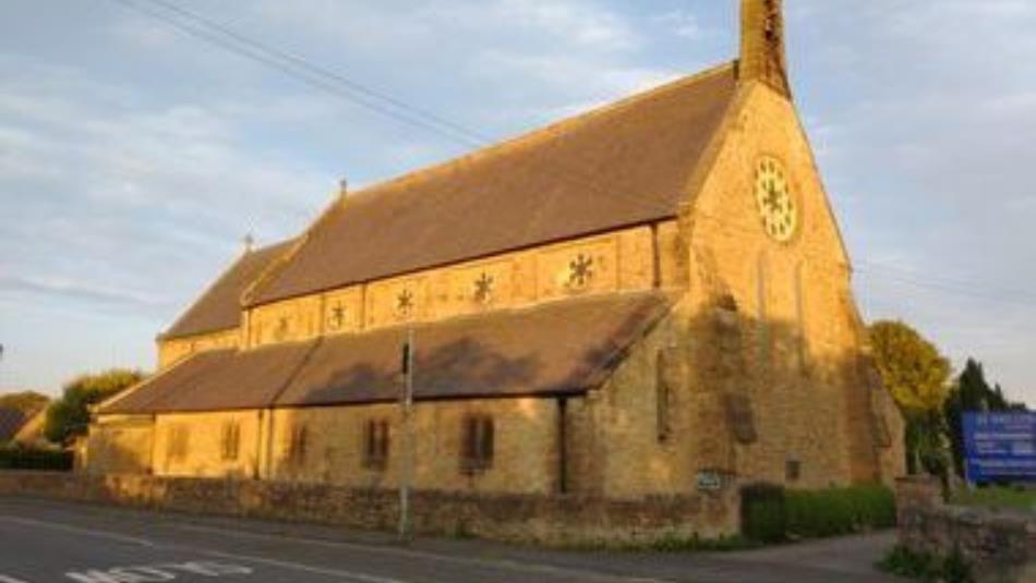 Exterior view of an ornate church in the sun.
