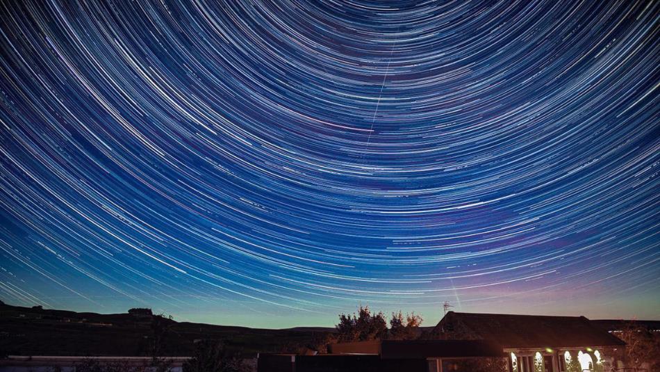 Star trails in a dark sky above the Grassholme Observatory.