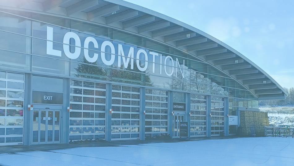 The front of Locomotion Museum covered in snow.