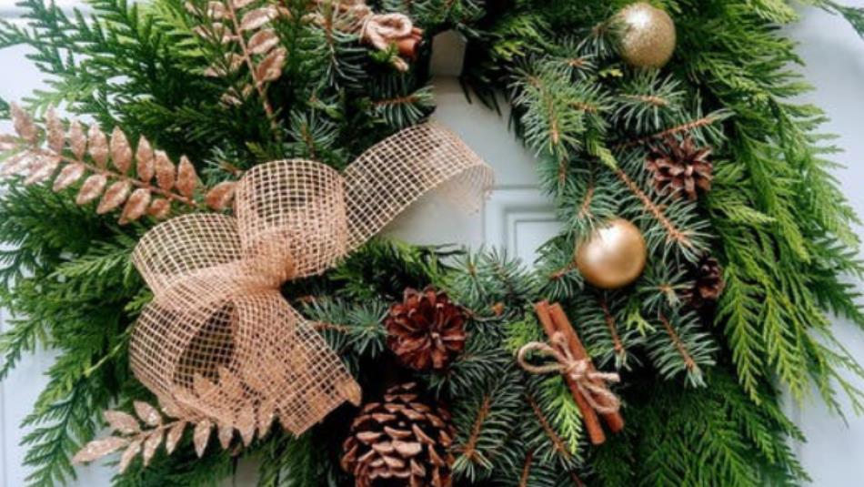 A festive wreath on a white door