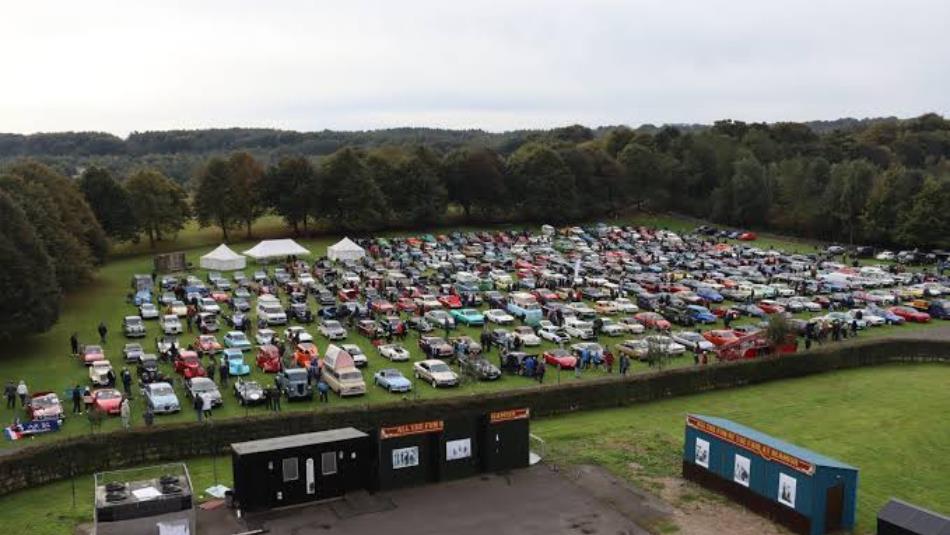 Rows of classic cars on a field