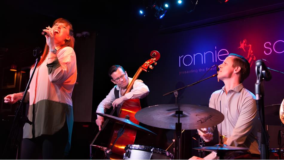 A jazz band playing on a colourful stage.