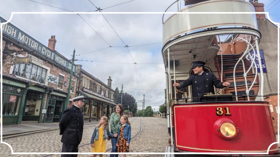 A historical street view, a tram driver on a vintage tram, smiling at children on the street.
