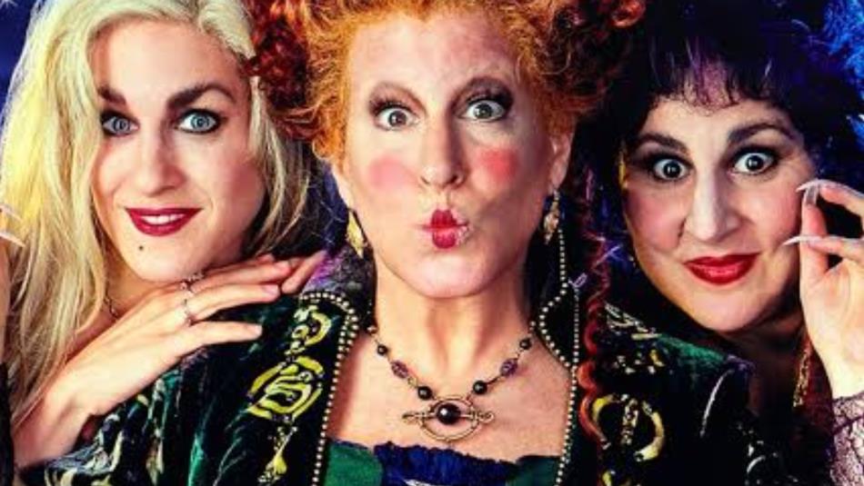 Three witches from Hocus Pocus, looking mischievously at the camera.