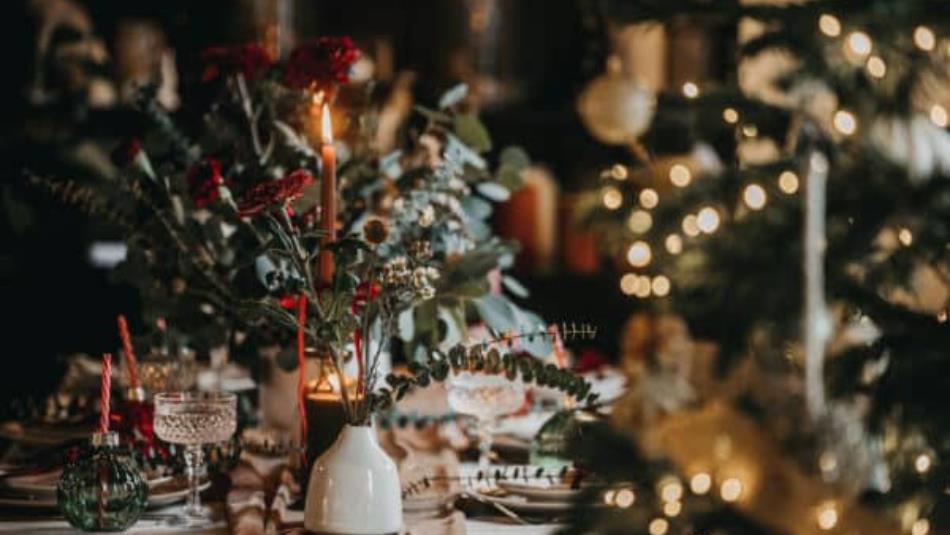 A festive table spread with twinkly lights.