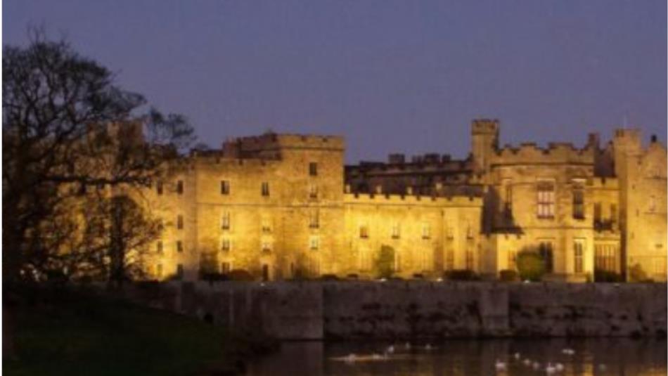 A view of Raby castle in the dark.