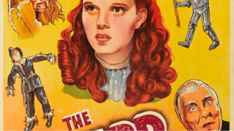 Illustrated characters from the Wizard of Oz, included Dorothy in the center, surrounded by Scarecrow, Tinman and the Lion, on a yellow background.