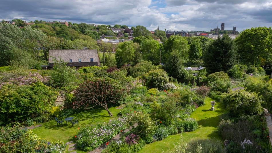 Landscape view of Crook Hall gardens in the summer, lush greenery
