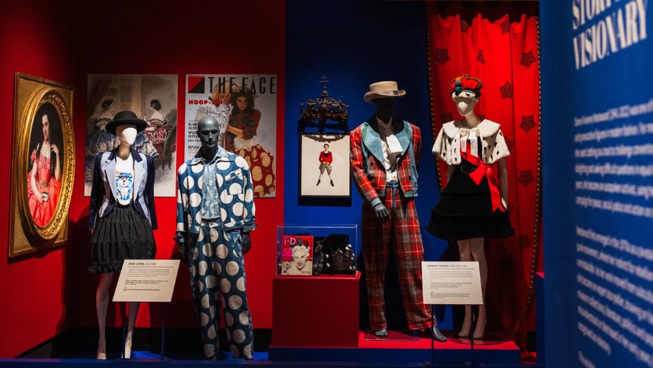Vivienne Westwood displays at the Bowes museum, tartan suits and polkadot clothing. Red and Blue theme.