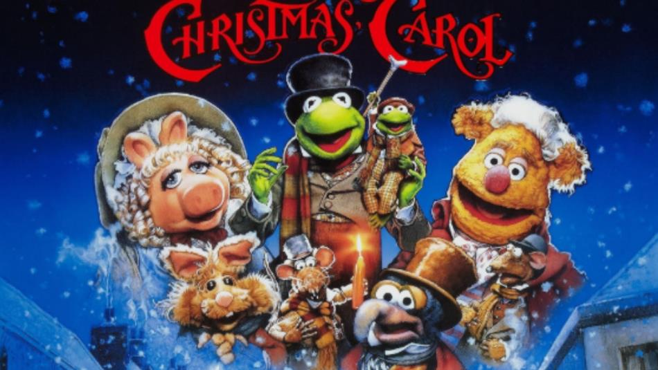 Muppets wearing Victorian Clothing gathered around in the snow in the Muppets Christmas Carol Poster
