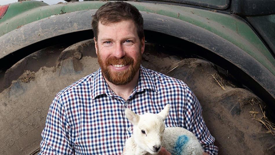Jim Smith holding a lamb