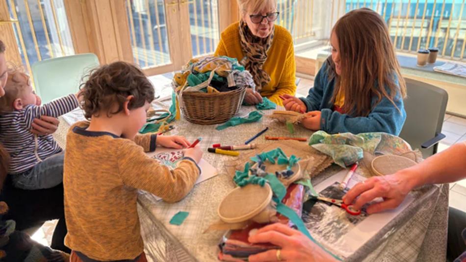 Children and families enjoying arts and crafts activities at Auckland Tower with artists.