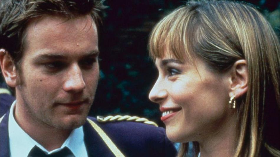 Image from movie. Ewan McGregor looking at Tara Fitzgerald in the film Brassed Off (1996).