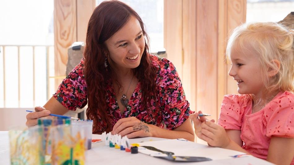 VE Celebrations family crafts - a woman and a child enjoying activities