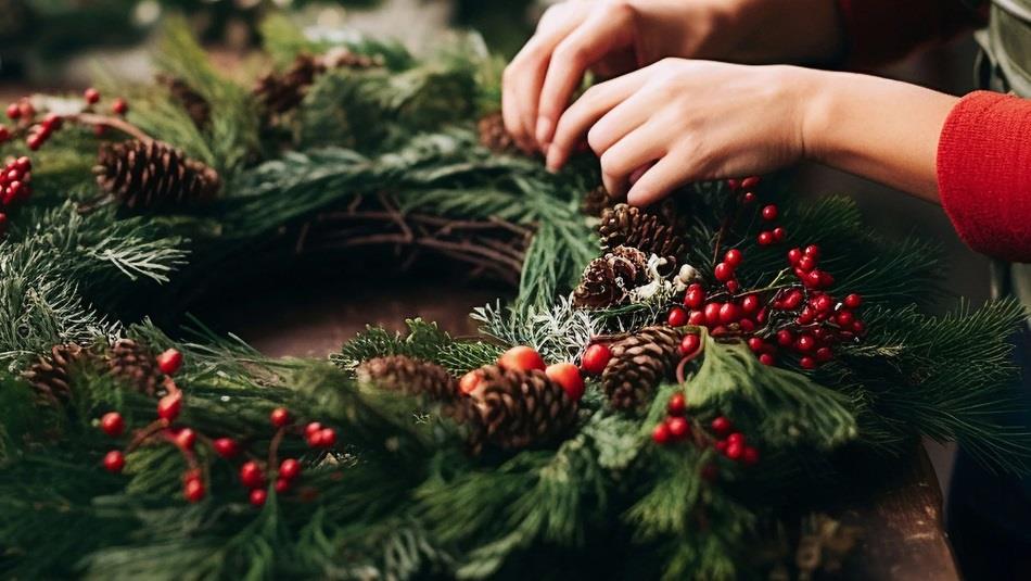 Someone making a Christmas Wreath