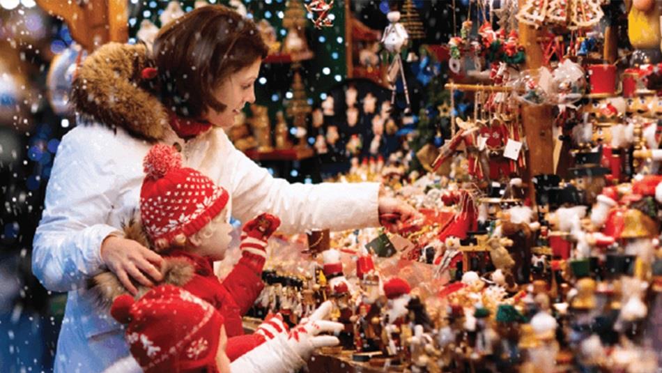 A family looking at a stall at the Beamish Hall Hotel Christmas Fair