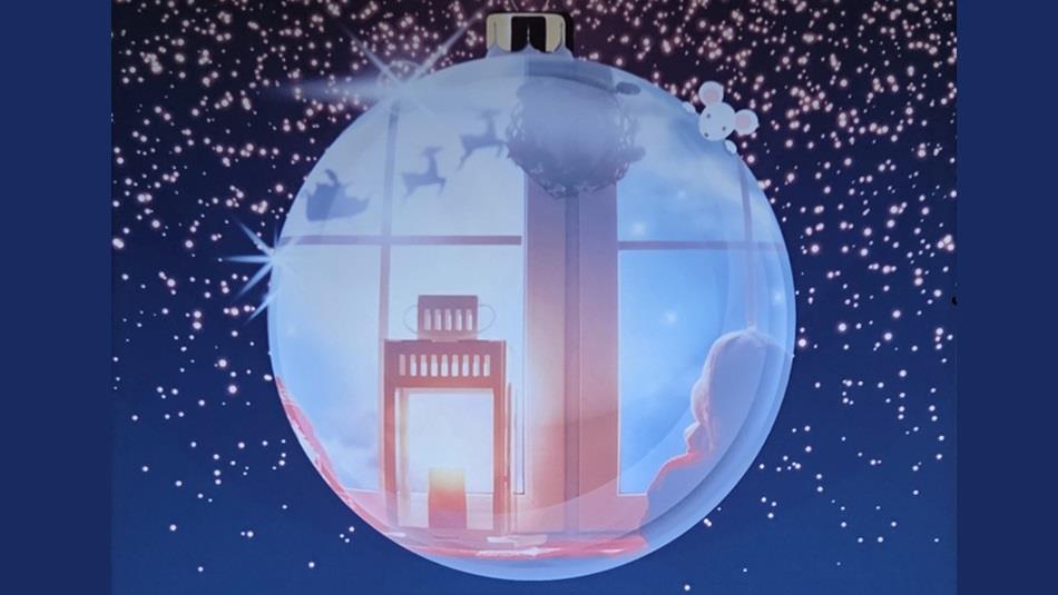 A festive scene inside a Christmas bauble.