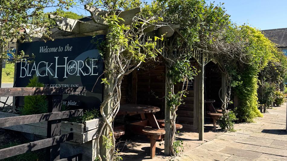 Outdoor, covered picnic area at The Black Horse Beamish