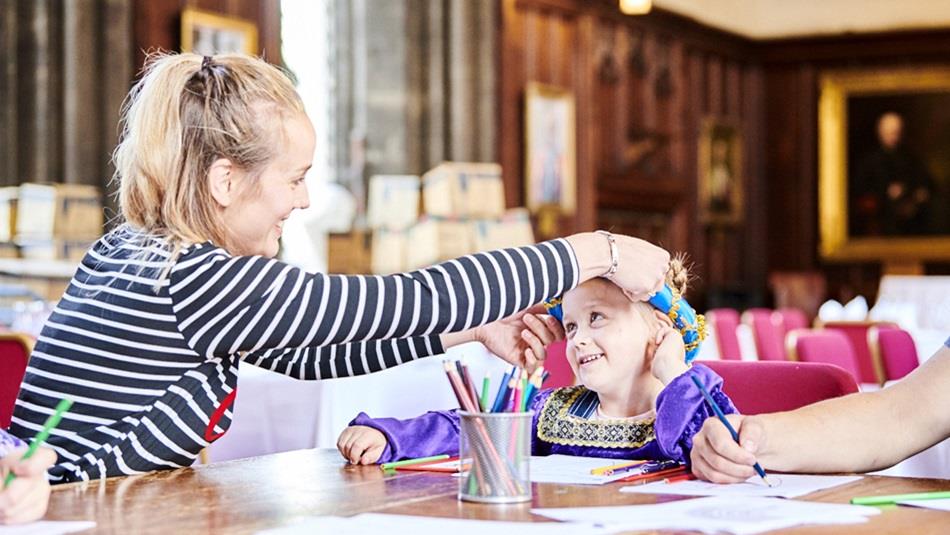 A woman and child taking part in craft activities in Durham Castle.